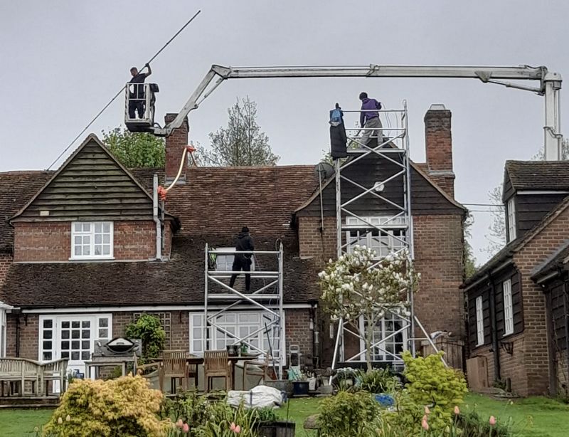 The Roof Moss Cleaners using cherry picker and scaffolding to clean roof safely and professionally in Faringdon, Oxfordshire