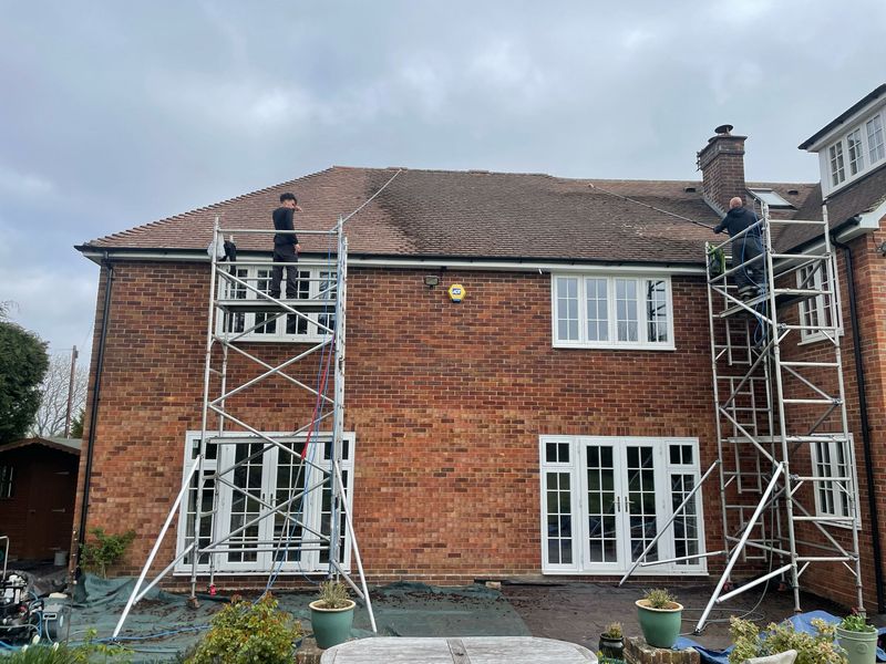 Roof cleaning carried out safely from scaffold towers by The Roof Moss Cleaners in Faringdon